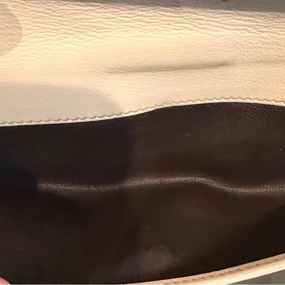 Gucci GG Canvas Long Wallet featuring white leather and heart-shaped closure